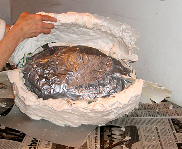 3.Opening the plaster cast to remove the clay form